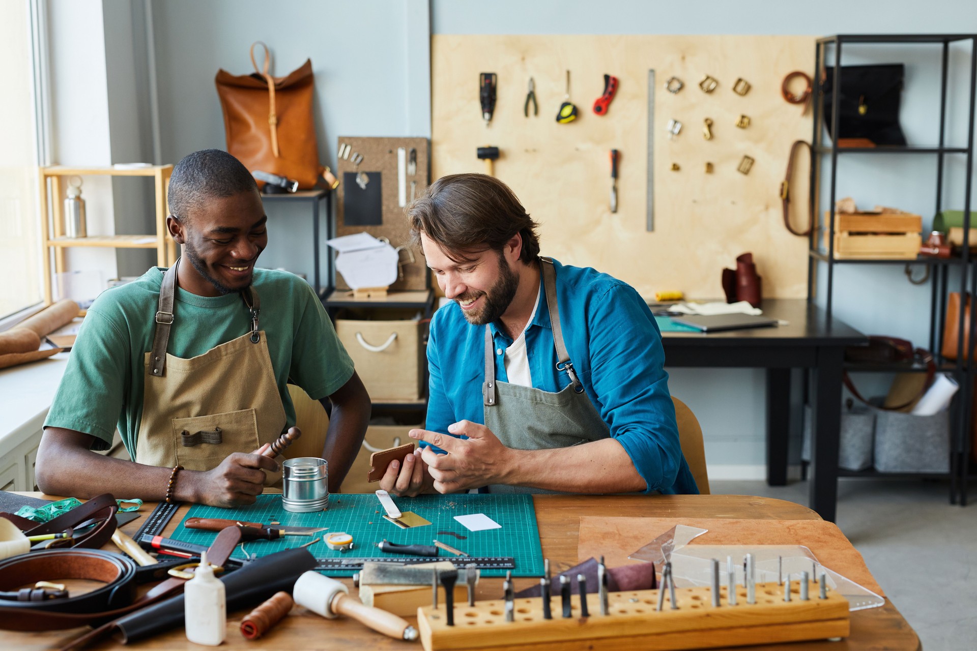 Two Men Enjoying Work in Workshop